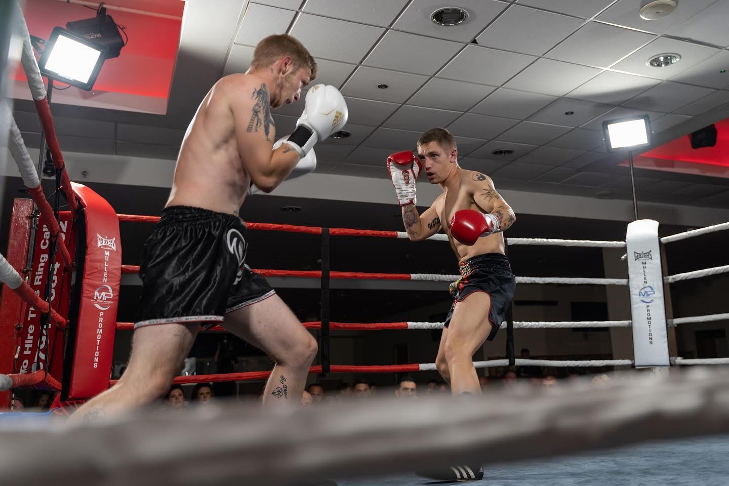 Boxing and padwork in the ring